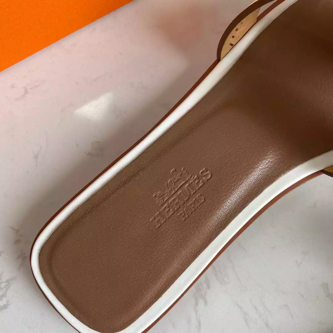 HERMES ORAN SLIDE SANDALS IN WHITE SWIFT PERFORATED CALFSKIN - HMSD101